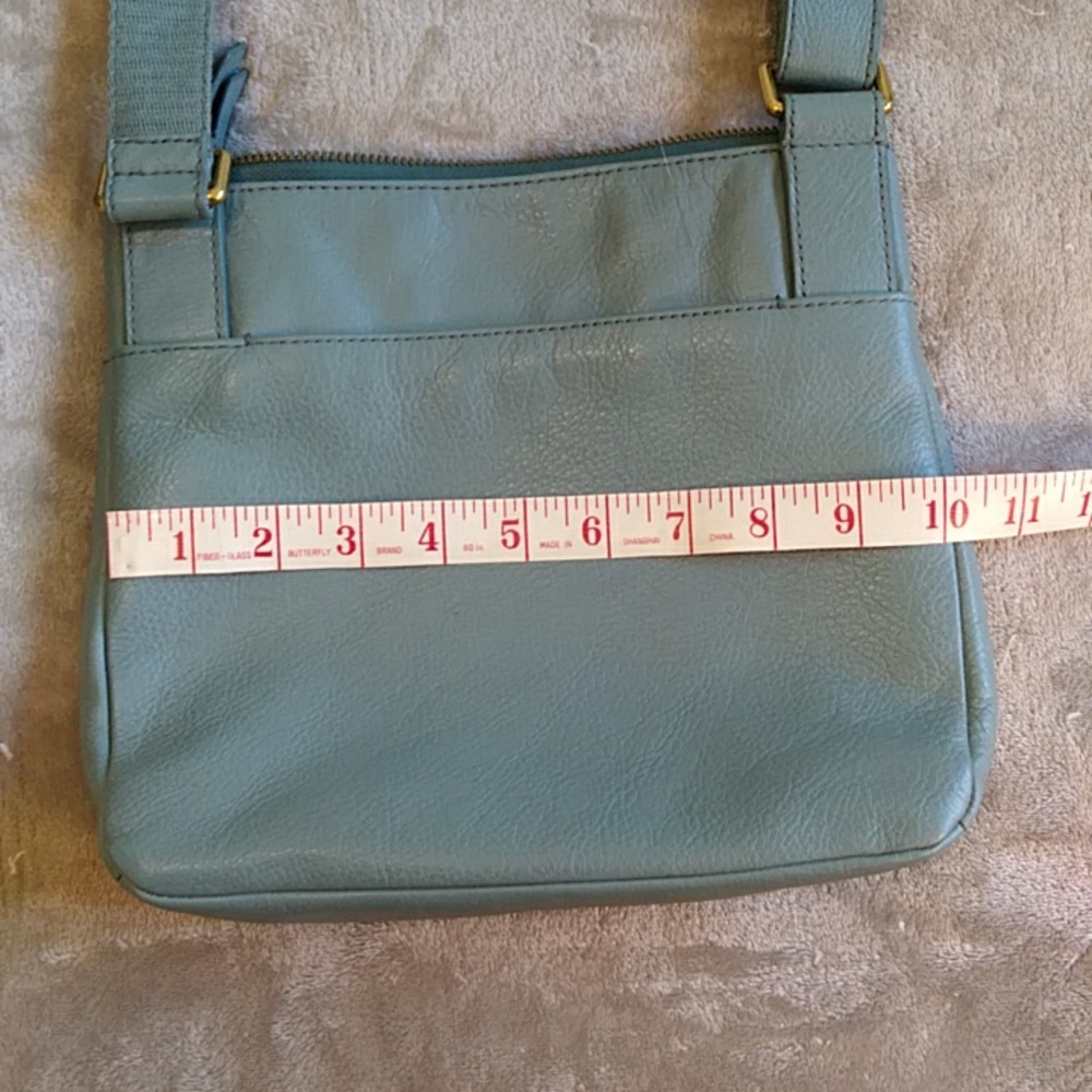 Fossil blue leather crossbody bag.
